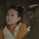 Leia in a tree with her droid.
